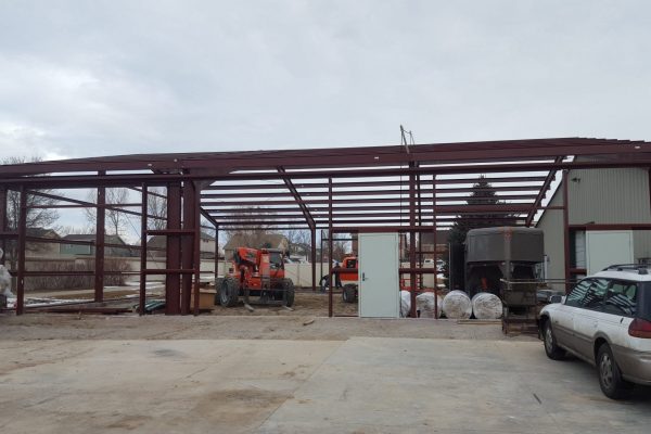 Steel building construction to match existing