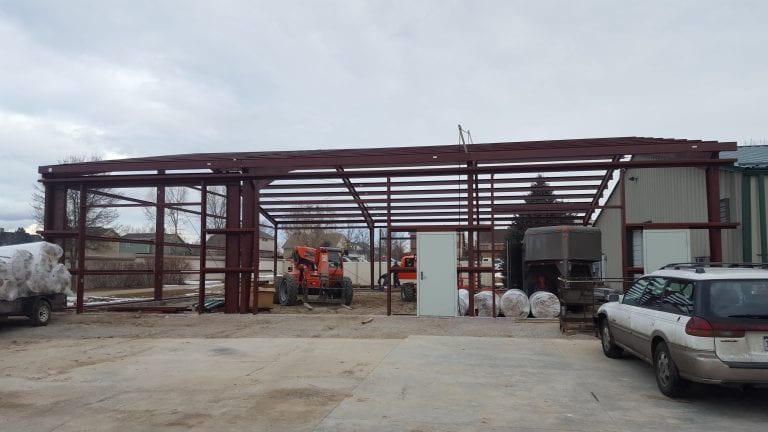 Steel building construction to match existing